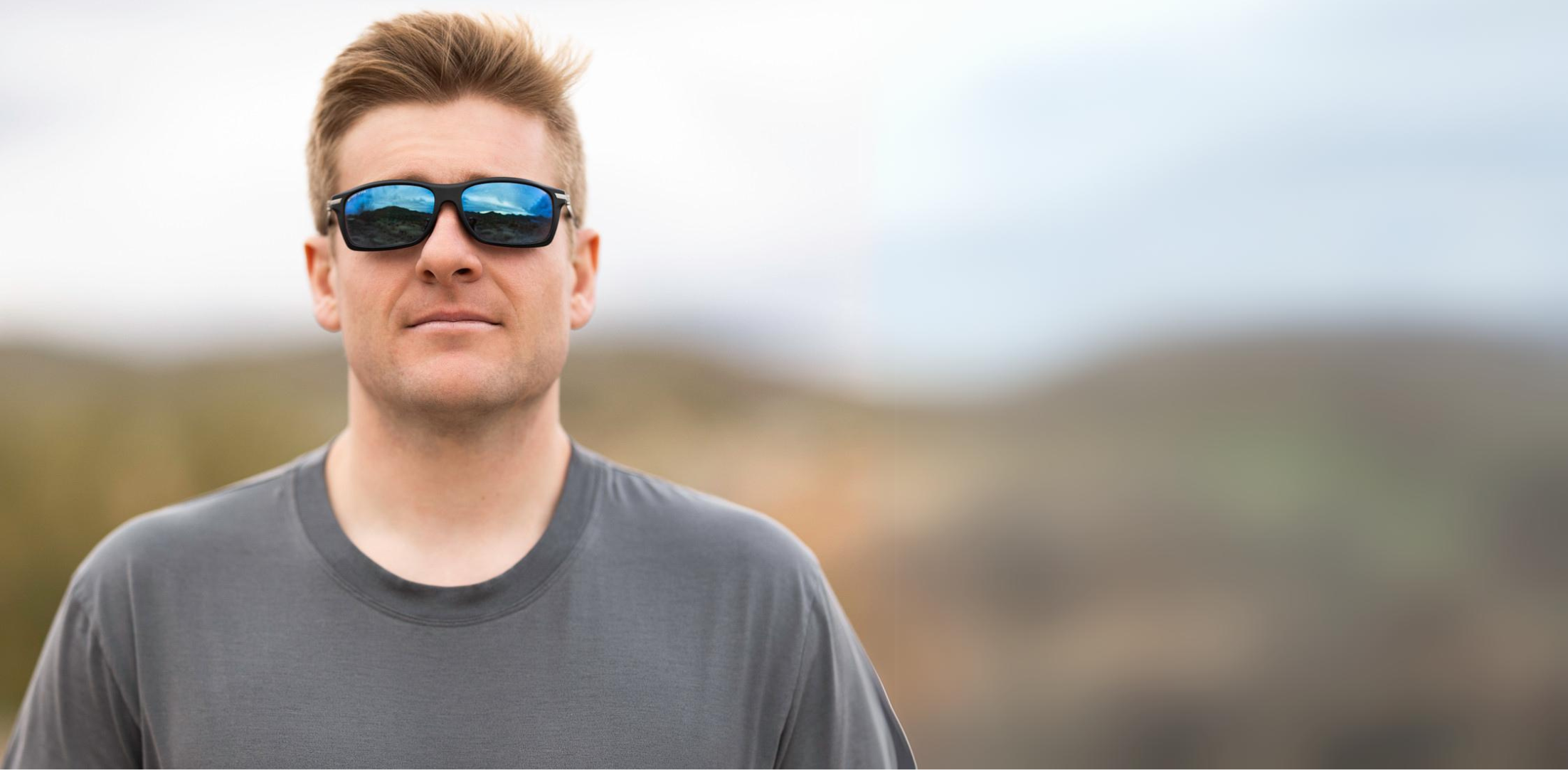 A person wearing Method Seven Pilot Altitude Wrap FLT18 sunglasses for pilots.