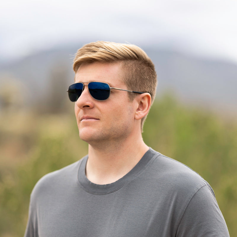 A person wearing Method Seven Pilot Ascent FLT18 sunglasses for pilots. 