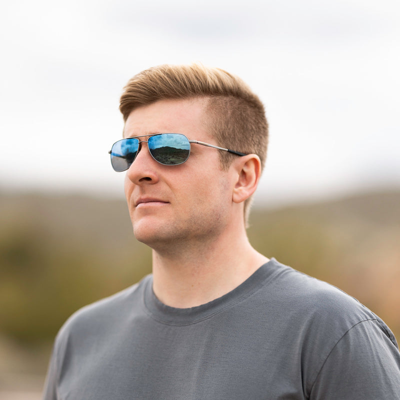 A person wearing Method Seven Pilot Ascent FLT18 sunglasses for pilots. 