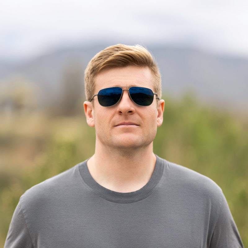 A person wearing Method Seven Pilot Ascent FLT18 sunglasses for pilots. 