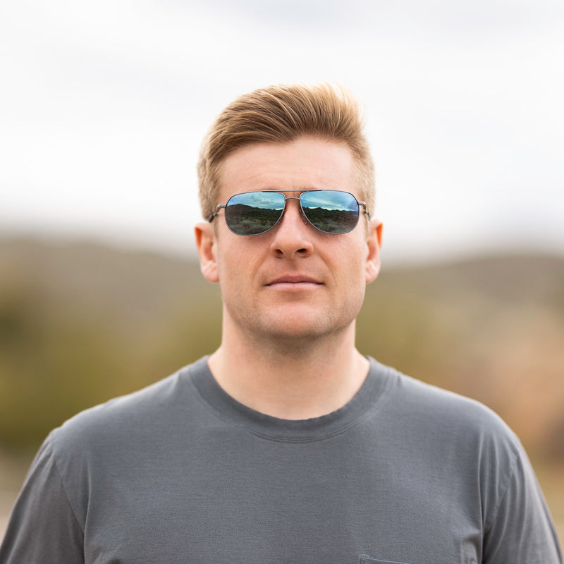 A person wearing Method Seven Pilot Ascent FLT18 sunglasses for pilots. 