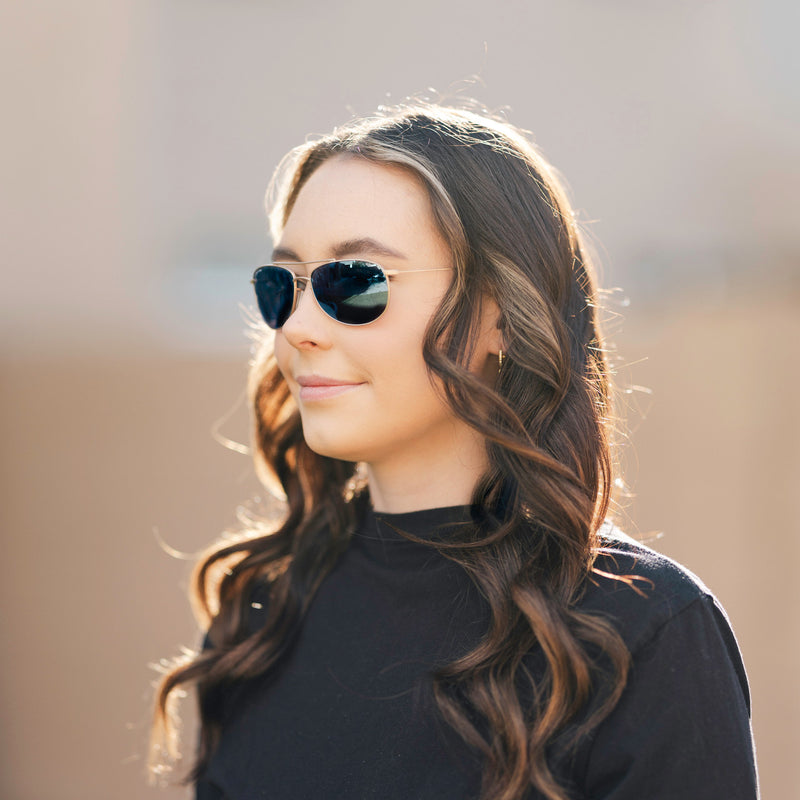 A person wearing Method Seven Pilot Aviatrix FLT18 sunglasses for pilots. 