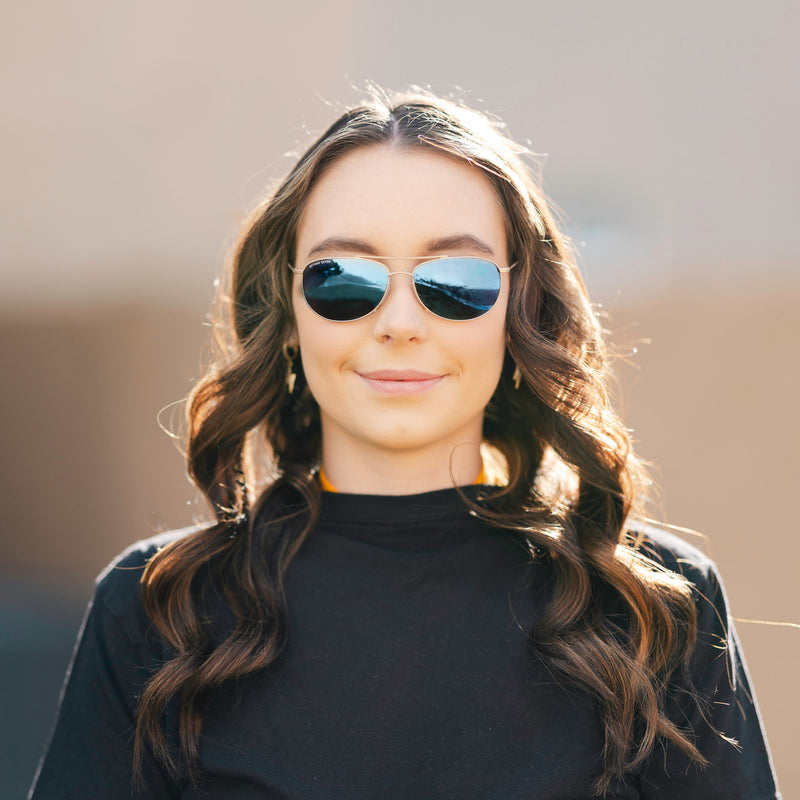 A person wearing Method Seven Pilot Aviatrix FLT18 sunglasses for pilots. 