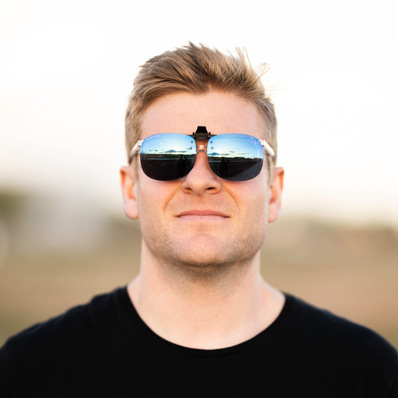 A person wearing Method Seven Pilot FLT18 Clip-On sunglasses for pilots. 